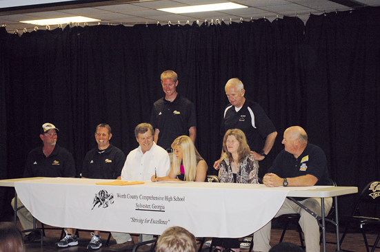 WCHS senior Brittany Pittman signs a soccer scholarship with Andrew College last Thursday morning. In addition to her parents James and Peggy, the Worth senior was joined on stage by coaches Terry Sinclair, Mitch Mitchell, Head Coach Colby Simpson, Athletic Director Russ Beard, and Andrew College Head Coach Blane.