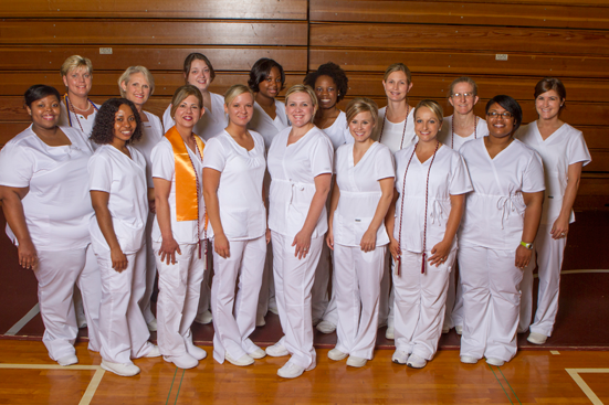 The nursing graduates from the Albany area pose before the nurse pinning ceremony. Front row from left to right: Krishondria Thomas, Theresa Uzodinma, Tina Giovingo, Carrie Pittman, Stacie Rolland, Kemberly Miller, Randee Roberts, and Latifah Powell. Back row from left to right: Mary Hart, Janet Grinder, Robin Hussion-Dale, Ebonee Purnell, RachelOluwo, Nicole Patteson, Susan Flowers, and Young Bozeman.