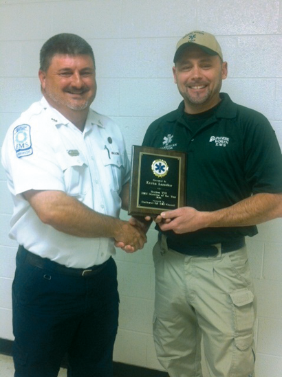 Robby Royal, Turner County EMS Director, presents 2014 Southwest Georgia’s EMS of the Year award to Phoebe Worth EMS Director Kevin Lassiter at the Region VIII banquet in Moultrie.